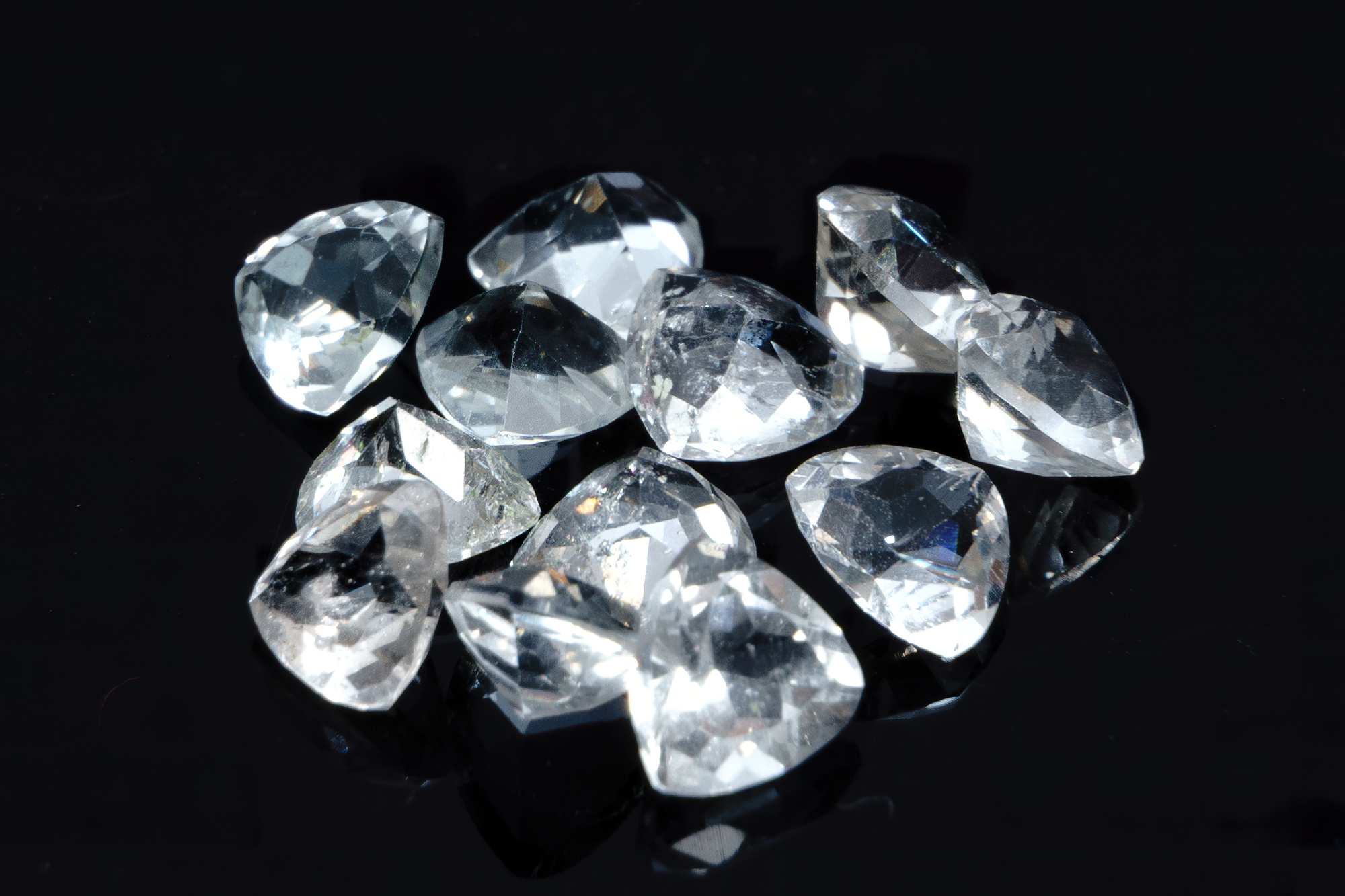 Natural gemstone white topaz on background